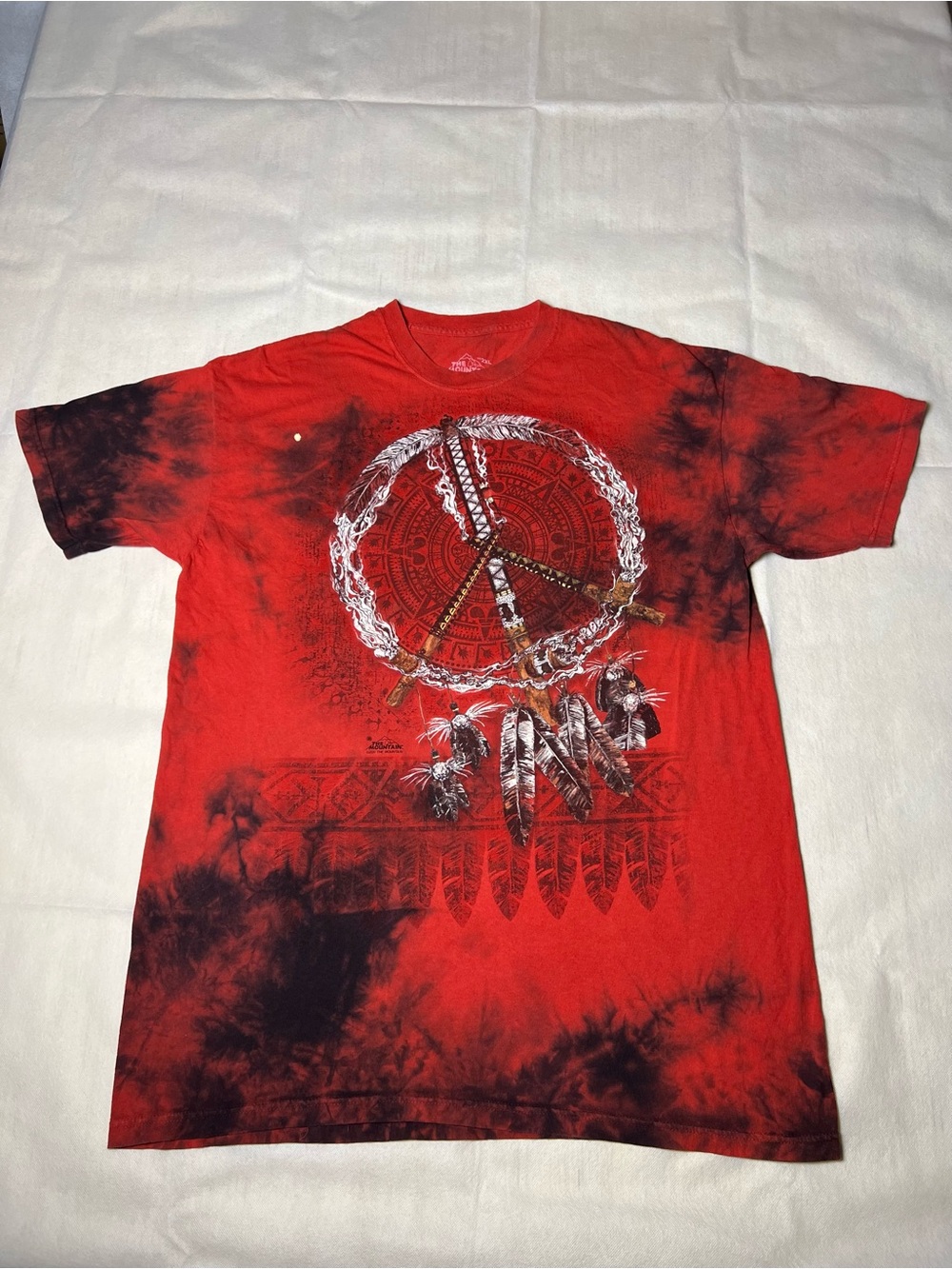 The Mountain red tie-dye tee with white peace sign graphic tee